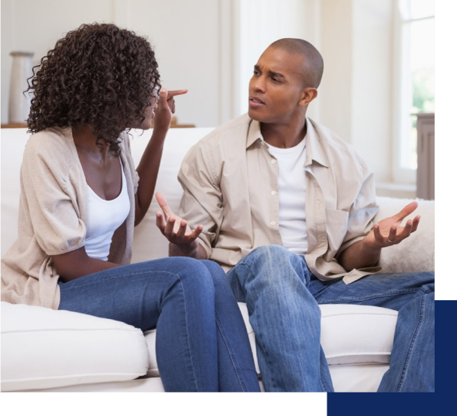 a couple arguing on the sofa. a therapy in Tustin, CA can help them