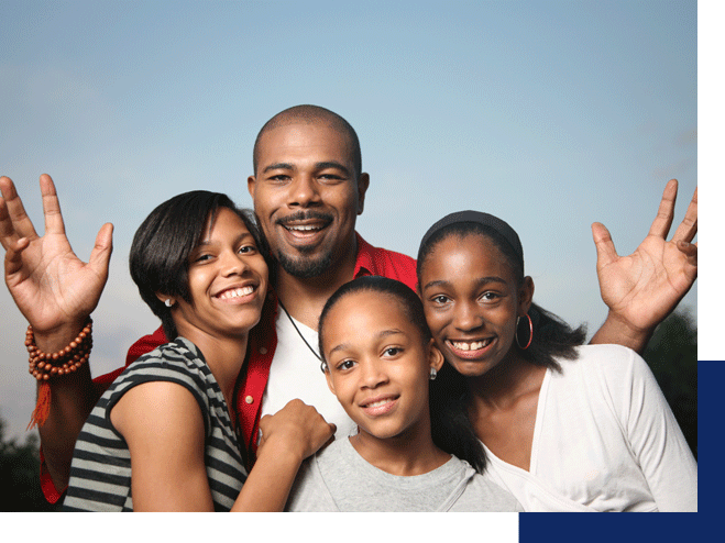 A smiling black family. ADHD counseling in Tustin can help your children thrive and bring back harmony to your family.